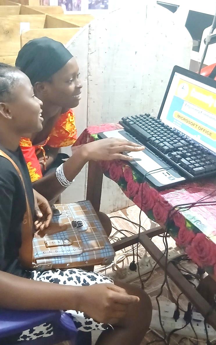 Two learners working through a Microsoft Office lesson at CCAP